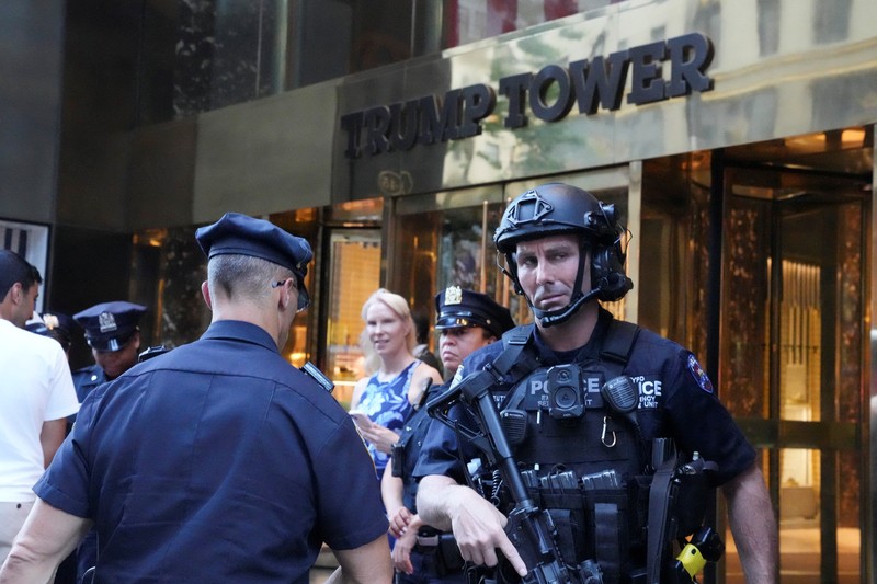 A member of security forces stands guard outside Trump Tower after Trump was injured when shots were fired during a campaign rally held in Butler, in New York, U.S., July 13, 2024.  REUTERS/David Dee Delgado
