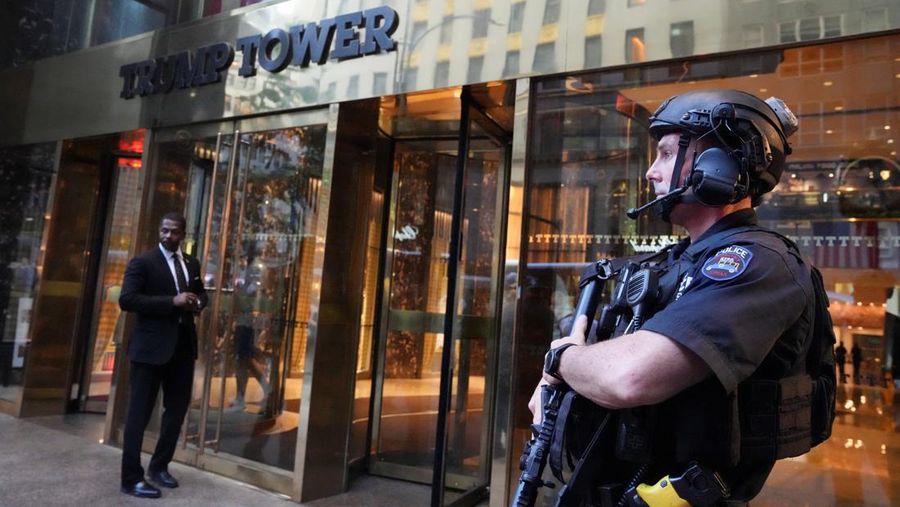 A member of security forces stands guard outside Trump Tower after Trump was injured when shots were fired during a campaign rally held in Butler, in New York, U.S., July 13, 2024.  REUTERS/David Dee Delgado