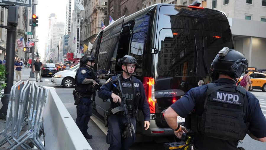 A member of security forces stands guard outside Trump Tower after Trump was injured when shots were fired during a campaign rally held in Butler, in New York, U.S., July 13, 2024.  REUTERS/David Dee Delgado