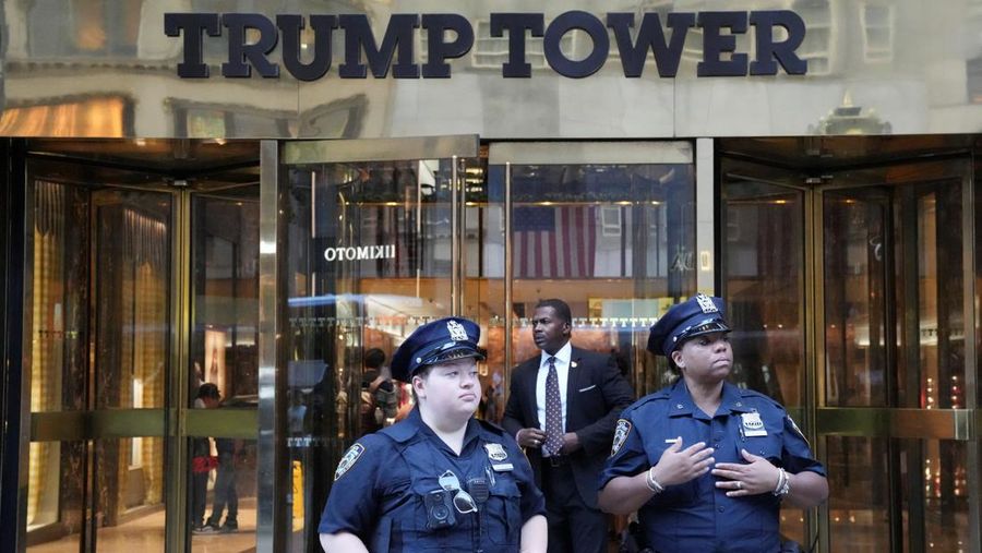 Security forces members stand guard outside Trump Tower after Trump was injured when shots were fired during a campaign rally held in Butler, in New York, U.S., July 13, 2024.  REUTERS/David Dee Delgado