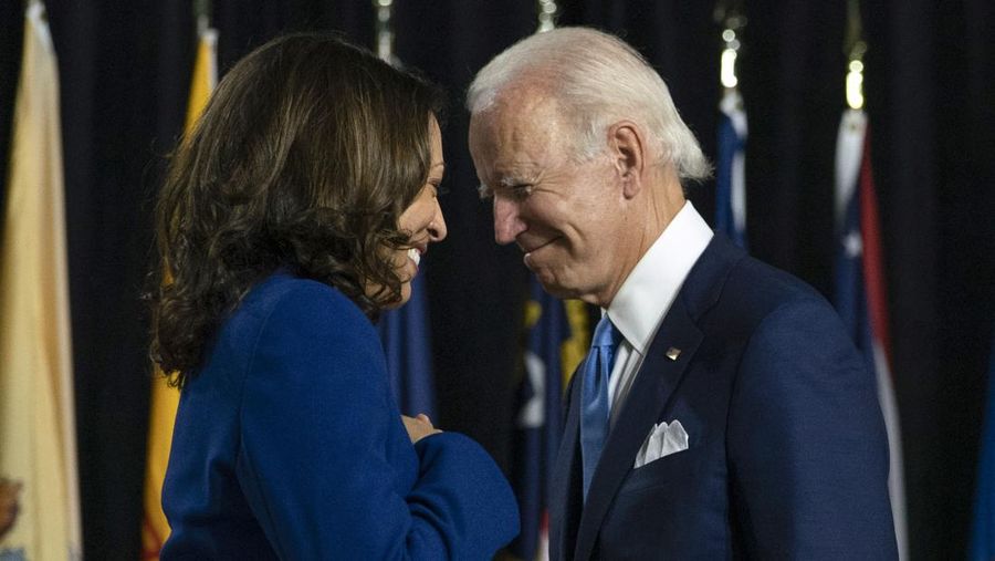 FILE - Democratic presidential candidate former Vice President Joe Biden and his running mate Sen. Kamala Harris, D-Calif., pass each other as Harris moves to the podium to speak during a campaign event in Wilmington, Del., Aug. 12, 2020. She’s already broken barriers, and now Vice President Harris could soon become the first Black woman to head a major party's presidential ticket after President Joe Biden’s ended his reelection bid. The 59-year-old Harris was endorsed by Biden on Sunday, July 21, after he stepped aside amid widespread concerns about the viability of his candidacy. (AP Photo/Carolyn Kaster, File)