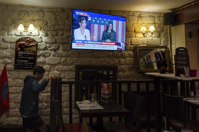 Election 2024 Harris A television broadcasts the news that Vice President Kamala Harris was endorsed by President Joe Biden after he dropped out of the 2024 race for the White House, Sunday, July 21, 2024., in Paris.