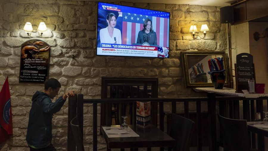 A television broadcasts the news that Vice President Kamala Harris was endorsed by President Joe Biden after he dropped out of the 2024 race for the White House, Sunday, July 21, 2024., in Paris.