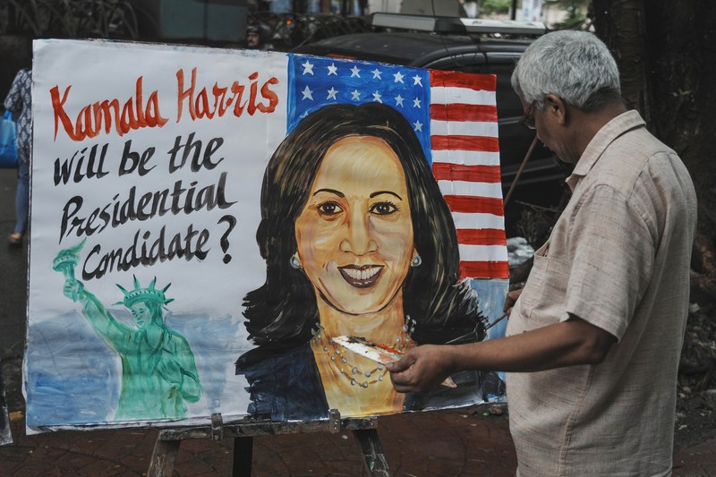 Indian art teacher Prithvi Raj Kambli, makes painting of US. Vice President Kamala Harris, in Mumbai, India, Monday, July 22, 2024. (AP Photo/Rafiq Maqbool)