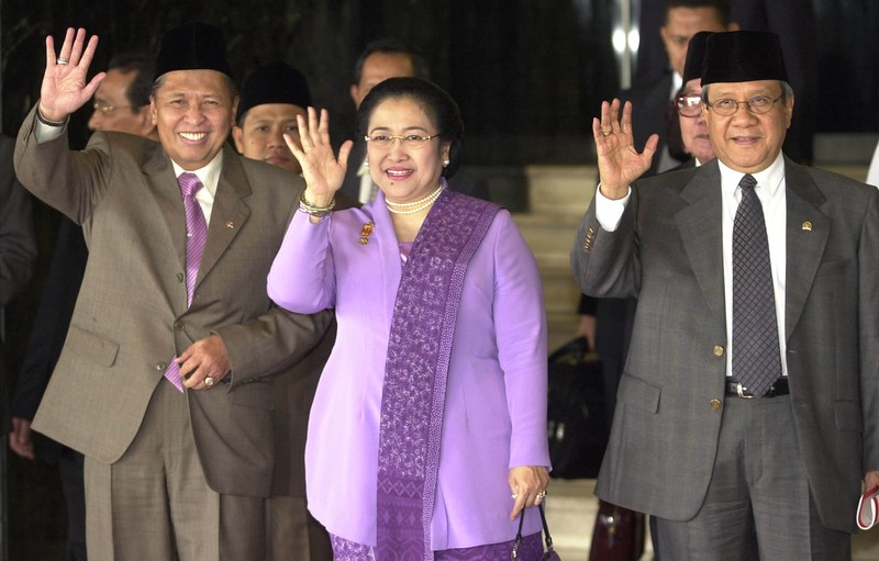 Indonesia's Vice President Hamzah Haz gestures as he speaks at a seminar in Jakarta, Indonesia, Wednesday, Dec. 18, 2002. Haz, a hard-line Islamic politician who has previously defended radicals and denied that Indonesia had a terrorism problem, on Tuesday downplayed his past differences with President Megawati Sukarnoputri saying that Indonesia's government is now united in fighting terrorism. (AP Photo/Muchtar Zakaria)