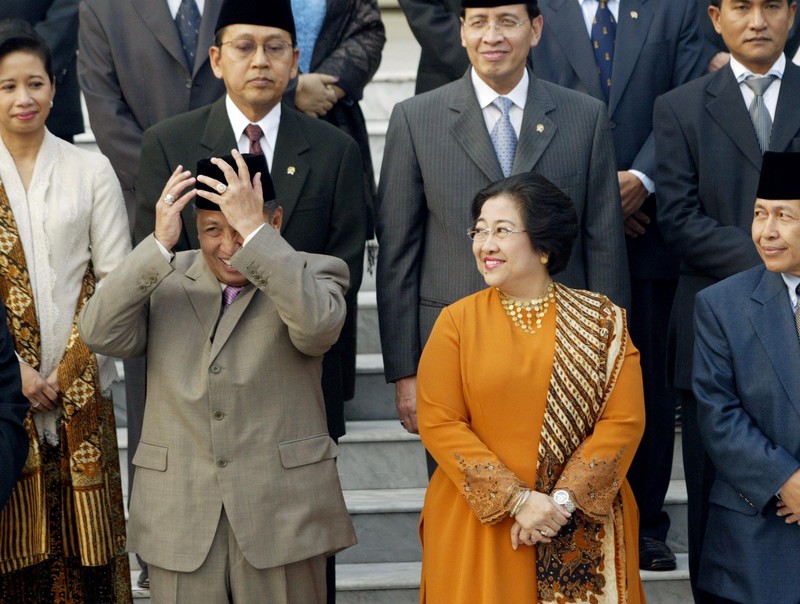 Indonesia's Vice President Hamzah Haz gestures as he speaks at a seminar in Jakarta, Indonesia, Wednesday, Dec. 18, 2002. Haz, a hard-line Islamic politician who has previously defended radicals and denied that Indonesia had a terrorism problem, on Tuesday downplayed his past differences with President Megawati Sukarnoputri saying that Indonesia's government is now united in fighting terrorism. (AP Photo/Muchtar Zakaria)