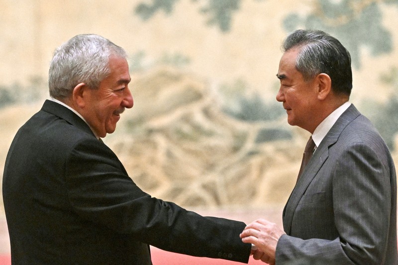 ISRAEL-PALESTINIANS/CHINA China's Foreign Minister Wang Yi looks on during the signing of the