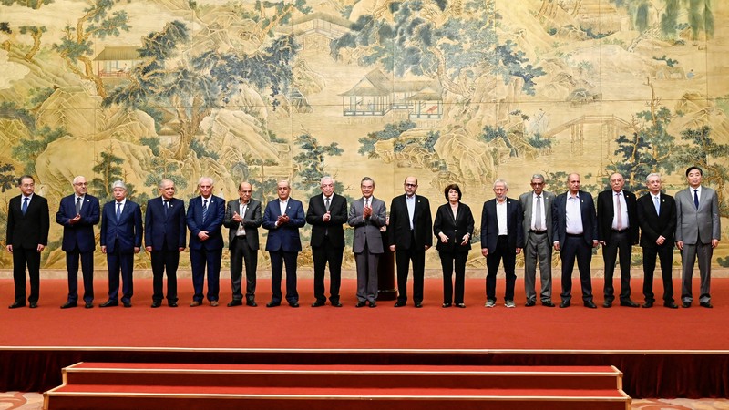 ISRAEL-PALESTINIANS/CHINA China's Foreign Minister Wang Yi looks on during the signing of the