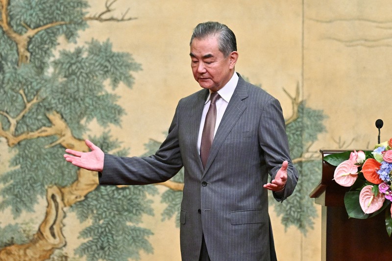 ISRAEL-PALESTINIANS/CHINA China's Foreign Minister Wang Yi looks on during the signing of the
