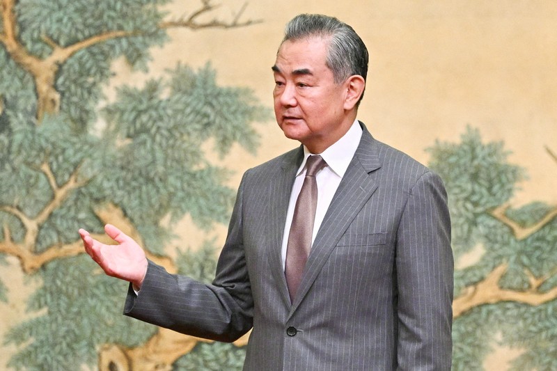 ISRAEL-PALESTINIANS/CHINA China's Foreign Minister Wang Yi looks on during the signing of the