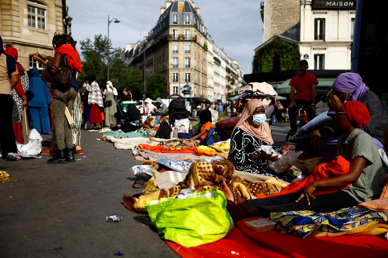 Homeless families, who were evacuated from street camps, camp out in front of the city hall of Paris' 18th district calling attention to their lack of housing ahead of the Paris 2024 Olympic Games, in Paris, France, July 25, 2024.  REUTERS/Sarah Meyssonnier