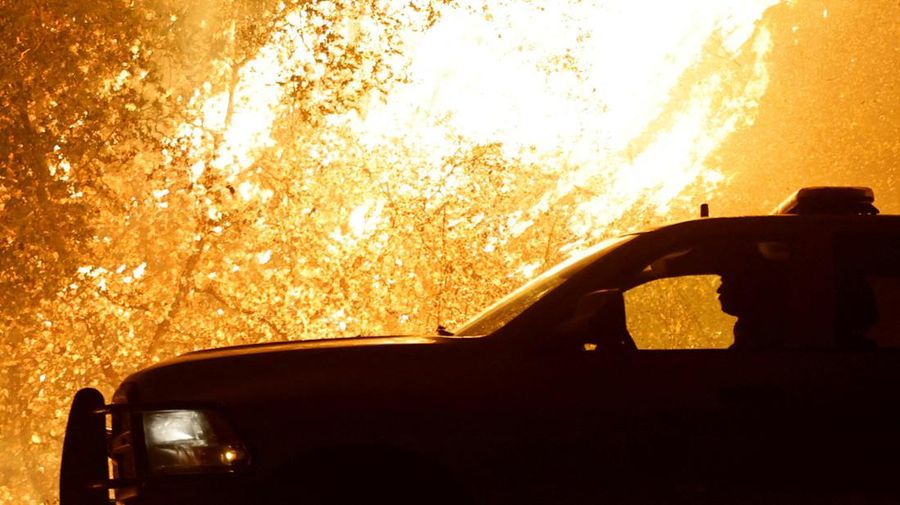 A firefighter works as Park Fire burns near Chico, California, U.S. July 24, 2024.  REUTERS/Fred Greaves