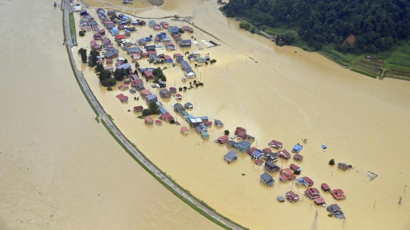 An aerial view shows a submerged residential area along Mogami river due to heavy rain in Tozawa Town, Yamagata Prefecture, northern Japan July 26, 2024, in this photo taken by Kyodo. Mandatory credit Kyodo/via REUTERS   ATTENTION EDITORS - THIS IMAGE HAS BEEN SUPPLIED BY A THIRD PARTY. MANDATORY CREDIT. JAPAN OUT. NO COMMERCIAL OR EDITORIAL SALES IN JAPAN.