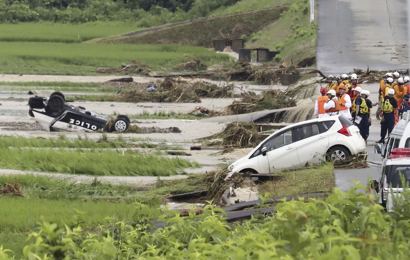 ASIA-WEATHER/JAPAN An aerial view shows a submerged residential area along Mogami river due to heavy rain in Tozawa Town, Yamagata Prefecture, northern Japan July 26, 2024, in this photo taken by Kyodo. Mandatory credit Kyodo/via REUTERS ATTENTION EDITORS - THIS IMAGE HAS BEEN SUPPLIED BY A THIRD PARTY. MANDATORY CREDIT. JAPAN OUT. NO COMMERCIAL OR EDITORIAL SALES IN JAPAN.