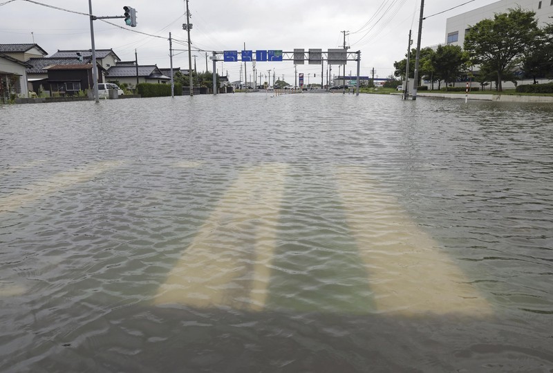 ASIA-WEATHER/JAPAN An aerial view shows a submerged residential area along Mogami river due to heavy rain in Tozawa Town, Yamagata Prefecture, northern Japan July 26, 2024, in this photo taken by Kyodo. Mandatory credit Kyodo/via REUTERS ATTENTION EDITORS - THIS IMAGE HAS BEEN SUPPLIED BY A THIRD PARTY. MANDATORY CREDIT. JAPAN OUT. NO COMMERCIAL OR EDITORIAL SALES IN JAPAN.