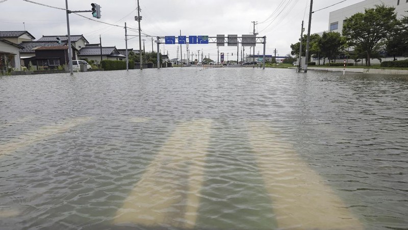An aerial view shows a submerged residential area along Mogami river due to heavy rain in Tozawa Town, Yamagata Prefecture, northern Japan July 26, 2024, in this photo taken by Kyodo. Mandatory credit Kyodo/via REUTERS   ATTENTION EDITORS - THIS IMAGE HAS BEEN SUPPLIED BY A THIRD PARTY. MANDATORY CREDIT. JAPAN OUT. NO COMMERCIAL OR EDITORIAL SALES IN JAPAN.