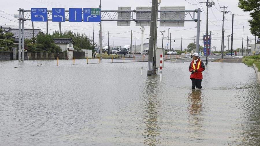 An aerial view shows a submerged residential area along Mogami river due to heavy rain in Tozawa Town, Yamagata Prefecture, northern Japan July 26, 2024, in this photo taken by Kyodo. Mandatory credit Kyodo/via REUTERS   ATTENTION EDITORS - THIS IMAGE HAS BEEN SUPPLIED BY A THIRD PARTY. MANDATORY CREDIT. JAPAN OUT. NO COMMERCIAL OR EDITORIAL SALES IN JAPAN.