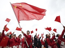China's Olympic athletes wave national flags from a boat for the opening ceremony of the 2024 Summer Olympics on the Seine River in Paris, Friday, July 26, 2024. (Cao Can/Pool Photo via AP)