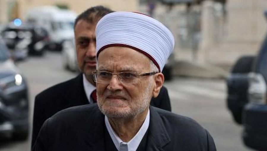 (FILES) Sheikh Ekrema Sabri, the former grand mufti of Jerusalem and Imam of the Aqsa mosque, arriving for questioning, over one of his sermons at the Israeli intelligence service office in Jerusalem on May 8, 2023. The former grand mufti of Jerusalem and current head of the Supreme Islamic Council in Jerusalem Sheikh Ekrima Sabri, 85-years-old, was detained on suspicion of inciting 