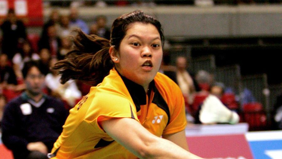 Netherlands' Mia Audina Tjiptawan lunges for a return to China's Zhang Ning during the finals of the Uber Cup badminton championships in Tokyo, Saturday, May 6, 2006. Mia Audina Tjiptawan lost the match 18-21, 21-19, 18-21.(AP Photo/Katsumi Kasahara)