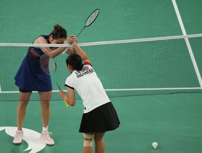 OLYMPICS-2024-BADMINTON/ Aksi badminton dari Indonesia Gregoria Mariska Tunjung beraksi saat bertanding melawan Ratchanok Intanon dari Thailand. REUTERS/Hamad I Mohammed