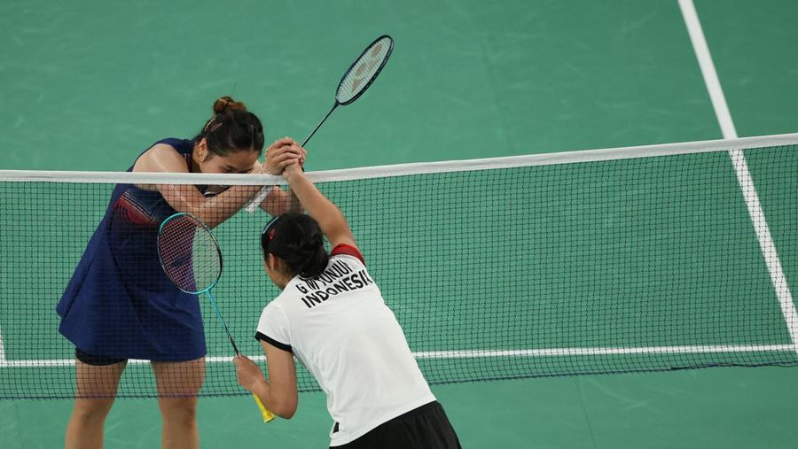 Aksi badminton dari Indonesia Gregoria Mariska Tunjung beraksi saat bertanding melawan Ratchanok Intanon dari Thailand. REUTERS/Hamad I Mohammed