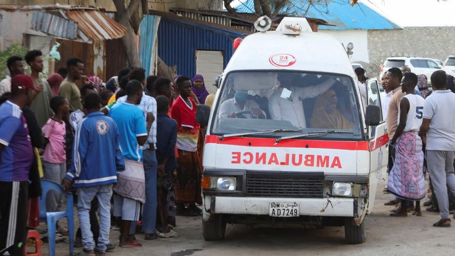 People gather as an ambulance carries the dead body of an unidentified woman killed in an explosion that occurred while revellers were swimming at the Lido beach in Mogadishu, Somalia August 3, 2024. REUTERS/Feisal Omar