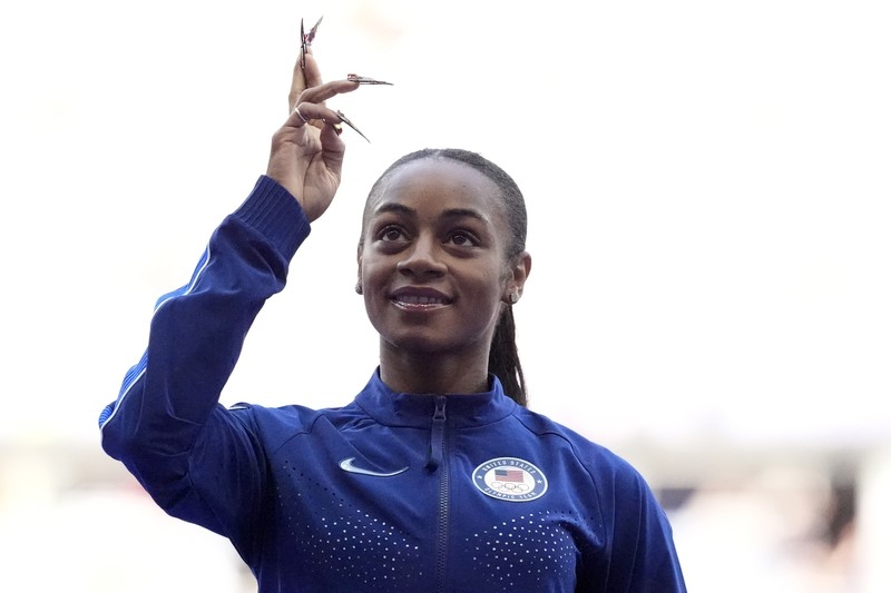 Sha'carri Richardson dari Amerika Serikat, memenangkan babak penyisihan lari 100 meter putri di Olimpiade Musim Panas 2024, Jumat, 2 Agustus 2024, di Saint-Denis, Prancis. Sha'carri Richardson dari Amerika Serikat, memenangkan babak penyisihan lari 100 meter putri di Olimpiade Musim Panas 2024, Jumat, 2 Agustus 2024, di Saint-Denis, Prancis. (AP Photo/Petr David Josek)