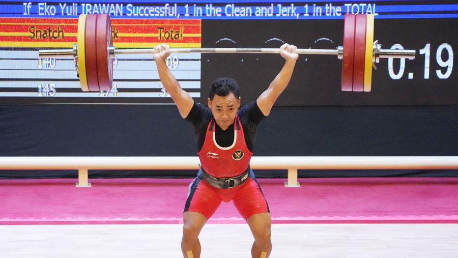 Atlet angkat besi Indonesia Eko Yuli Irawan berlaga di nomor angkat besi putra kelas 61 kg pada SEA Games ke-31 di Hanoi, Vietnam, Jumat, 20 Mei 2022. (AP Photo/Achmad Ibrahim) Atlet angkat besi Indonesia Eko Yuli Irawan berlaga di nomor angkat besi putra kelas 61 kg pada SEA Games ke-31 di Hanoi, Vietnam, Jumat, 20 Mei 2022. (AP Photo/Achmad Ibrahim)
