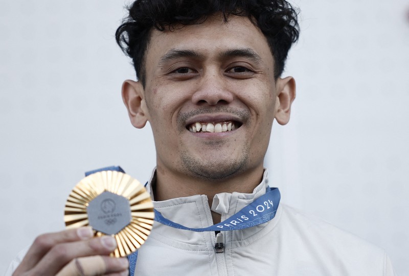 Peraih medali emas Veddriq Leonardo dari Indonesia, peraih medali perak Peng Wu dari Tiongkok dan peraih medali perunggu Sam Watson dari Amerika Serikat berpose dengan medali. Peraih medali emas Veddriq Leonardo dari Indonesia, peraih medali perak Peng Wu dari Tiongkok dan peraih medali perunggu Sam Watson dari Amerika Serikat berpose dengan medali. (REUTERS/Benoit Tessier)