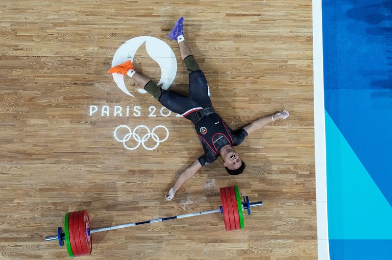 Atlet angkat besi Indonesia Rizki Juniansyah yang turun di nomor 73 kg pada Olimpiade Paris 2024 sukses menyabet medali emas. Hasil ini membuat Indonesia meraih 2 medali emas setelah di hari yang sama Veddriq Leonardo menyumbangkan emas di cabang panjat tebing. (REUTERS/Amanda Perobelli) Atlet angkat besi Indonesia Rizki Juniansyah yang turun di nomor 73 kg pada Olimpiade Paris 2024 sukses menyabet medali emas. Hasil ini membuat Indonesia meraih 2 medali emas setelah di hari yang sama Veddriq Leonardo menyumbangkan emas di cabang panjat tebing. (REUTERS/Amanda Perobelli)