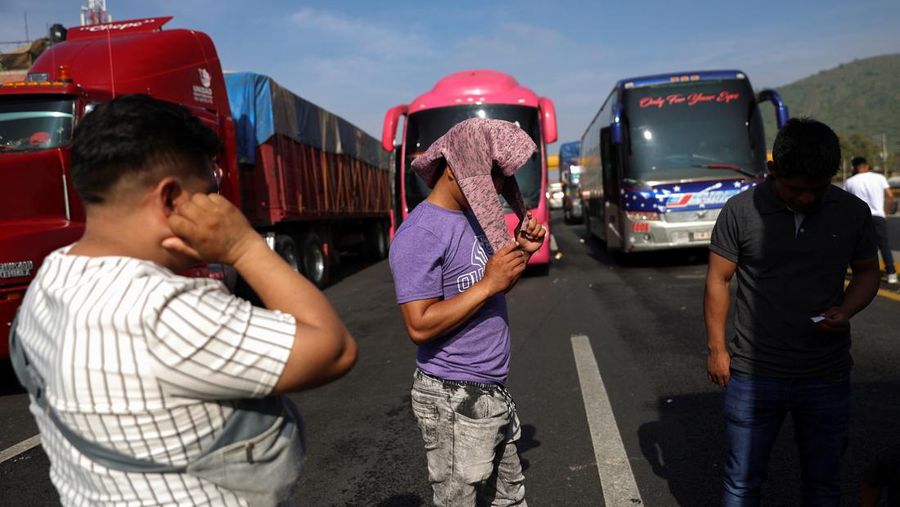 A drone view shows trailers and vehicles stranded as farmers from Santa Rita Tlahuapan block a highway to demand payment for the land expropriated for the construction of the expressway, in Tlahuapan, Puebla state, Mexico August 8, 2024. REUTERS/Diego Delgado
