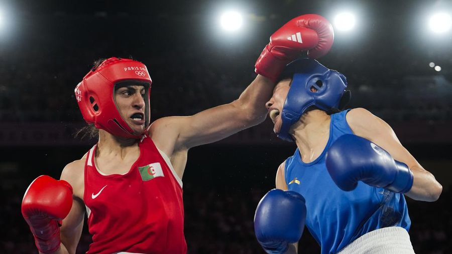 Algeria's Imane Khelif, left, fights China's Yang Liu in their women's 66 kg final boxing match at the 2024 Summer Olympics, Friday, Aug. 9, 2024, in Paris, France. (AP Photo/Ariana Cubillos)