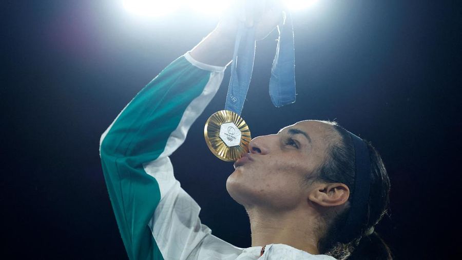 Algeria's Imane Khelif, left, fights China's Yang Liu in their women's 66 kg final boxing match at the 2024 Summer Olympics, Friday, Aug. 9, 2024, in Paris, France. (AP Photo/Ariana Cubillos)