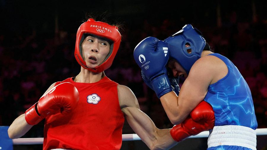 Algeria's Imane Khelif, left, fights China's Yang Liu in their women's 66 kg final boxing match at the 2024 Summer Olympics, Friday, Aug. 9, 2024, in Paris, France. (AP Photo/Ariana Cubillos)