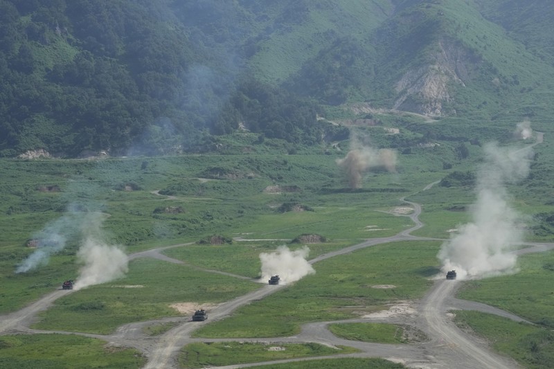 SOUTHKOREA-USA/DRILLS A U.S. M1A2 Abrams battle tank fires during a live-fire drill of U.S. Army's 1st Armored Brigade Combat Team, 1st Armored Division at the Rodriguez Live Fire Complex, in Pocheon, South Korea, August 14, 2024. REUTERS/Kim Soo-hyeon