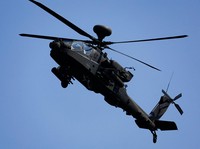 An AH-64 Apache helicopter flies during a live-fire drill of the U.S. Army's 1st Armored Brigade Combat Team, 1st Armored Division at the Rodriguez Live Fire Complex, in Pocheon, South Korea, August 14, 2024. REUTERS/Kim Soo-hyeon