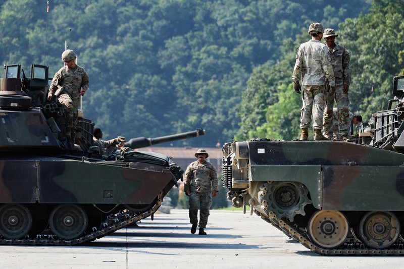 A U.S. M1A2 Abrams battle tank fires during a live-fire drill of U.S. Army's 1st Armored Brigade Combat Team, 1st Armored Division at the Rodriguez Live Fire Complex, in Pocheon, South Korea, August 14, 2024. REUTERS/Kim Soo-hyeon