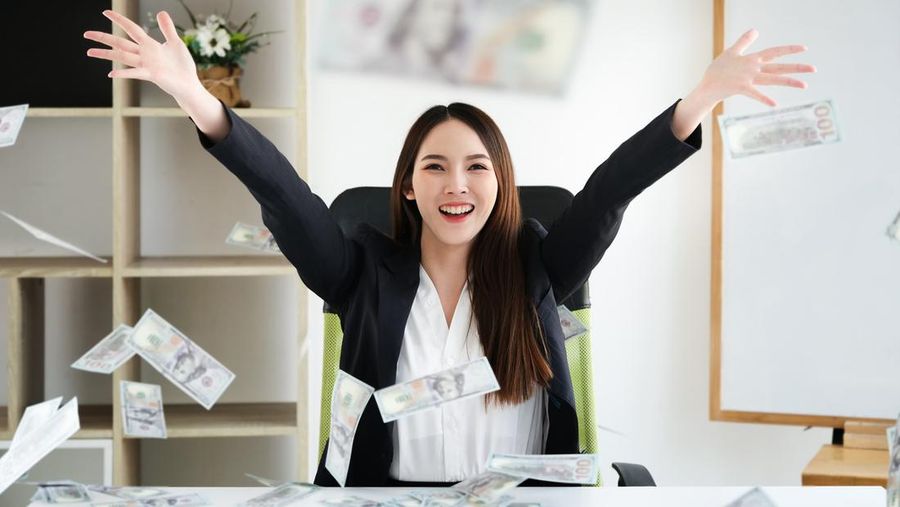 business women hug money on office her, concept for success business and  Financial freedom.