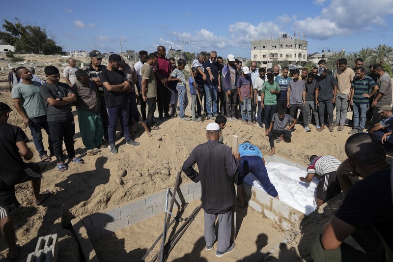 Israel Palestinians Death Without Dignity Palestinian mourners carry their loved one for burial at the cemetery in Deir al-Balah, Gaza Strip, Friday, Aug. 9, 2024. (AP Photo/Abdel Kareem Hana)