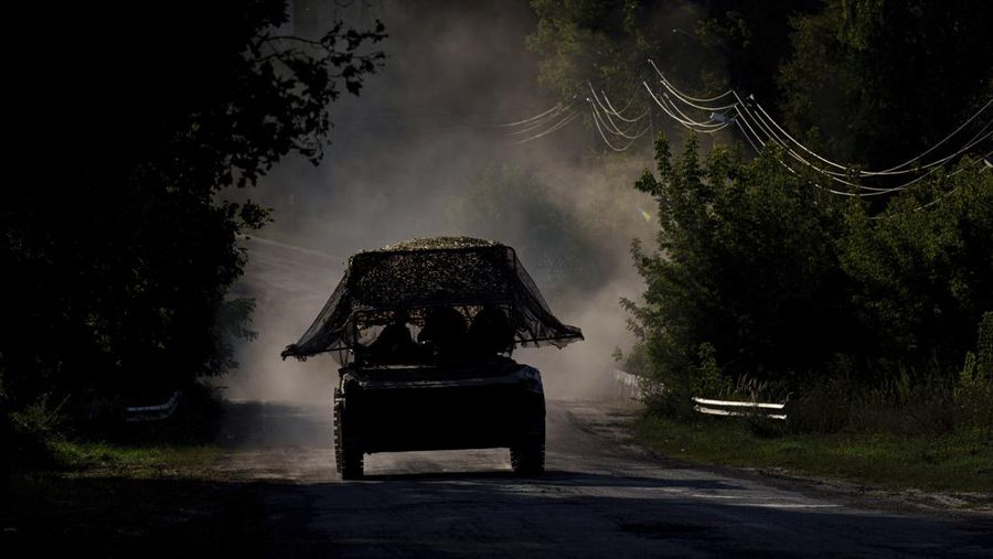 A Ukrainian armoured military vehicle travels near the Russian-Ukrainian border, Sumy region, Ukraine, Wednesday, Aug. 14, 2024. (AP Photo/Evgeniy Maloletka)