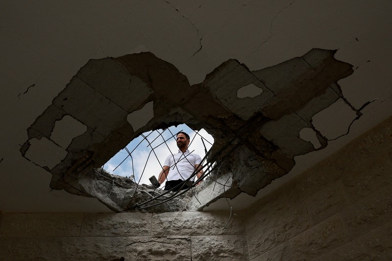 Sayap bersenjata Hamas Brigade Al Qassam mengklaim telah menembakkan roket M90 ke Ibu Kota Tel Aviv, Israel, pada Minggu (25/8) malam. (REUTERS/Ammar Awad) Sayap bersenjata Hamas Brigade Al Qassam mengklaim telah menembakkan roket M90 ke Ibu Kota Tel Aviv, Israel, pada Minggu (25/8) malam. (REUTERS/Ammar Awad)