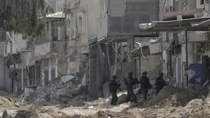 Members of Israeli forces patrol a street during a military operation in the West Bank refugee camp of Nur Shams, Tulkarem, Thursday, Aug. 29, 2024. (AP Photo/Majdi Mohammed)