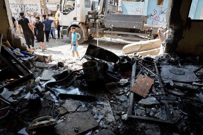 Israel Palestinians Palestinians stand outside a heavily damaged mosque following an Israeli military operation in the West Bank refugee camp of Al-Faraa, Thursday, Aug. 29, 2024. (AP Photo/Nasser Nasser)