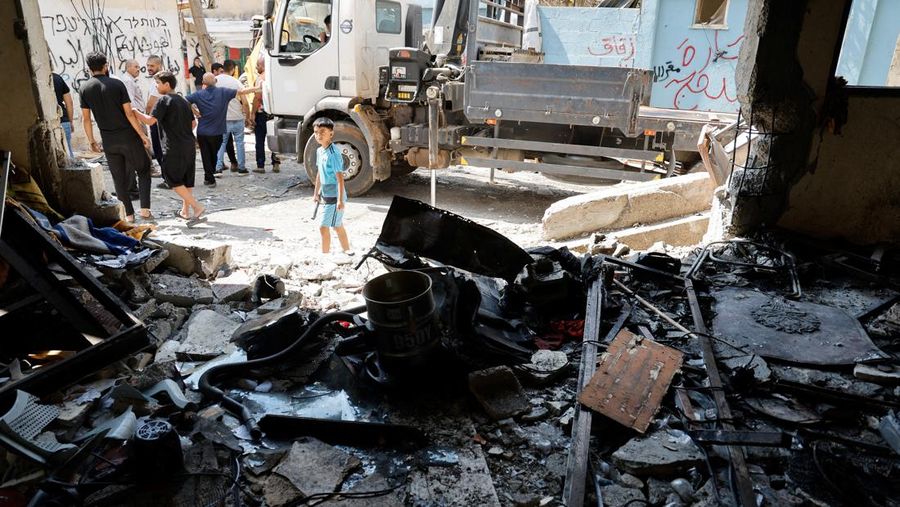 Palestinians inspect the damage, following an Israeli military raid in Al-Faraa camp, near Tubas, in the Israeli-occupied West Bank, August 29, 2024. REUTERS/Raneen Sawafta