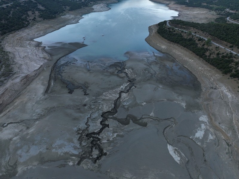 The reappearing remains of buildings of the village of Kallio, which was intentionally flooded in 1980 to create a reservoir that would help meet the water needs of Greek capital Athens, are seen following receding water levels caused by drought, in Lake Mornos, Greece, September 3, 2024. REUTERS/Stelios Misinas