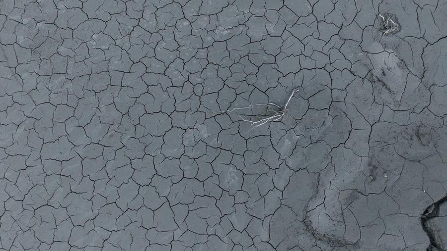 The reappearing remains of buildings of the village of Kallio, which was intentionally flooded in 1980 to create a reservoir that would help meet the water needs of Greek capital Athens, are seen following receding water levels caused by drought, in Lake Mornos, Greece, September 3, 2024. REUTERS/Stelios Misinas
