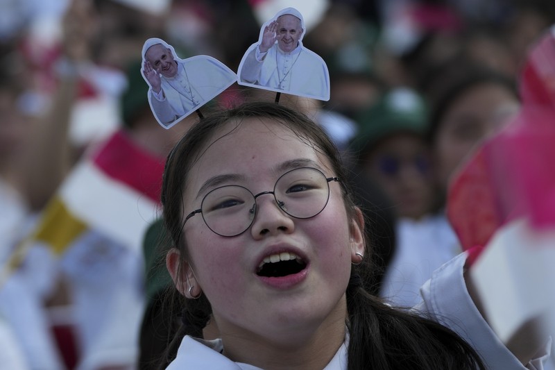 People wait for the arrival of Pope Francis before a mass at the Gelora Bung Karno Stadium in Jakarta, Thursday, Sept. 5, 2024. (Yasuyoshi Chiba/Pool Photo via AP)