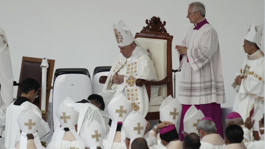 Pope Francis, seated, leads the holy mass at Gelora Bung Karno Stadium in Jakarta, Indonesia, Thursday, Sept. 5, 2024. (AP Photo/Dita Alangkara, Pool)