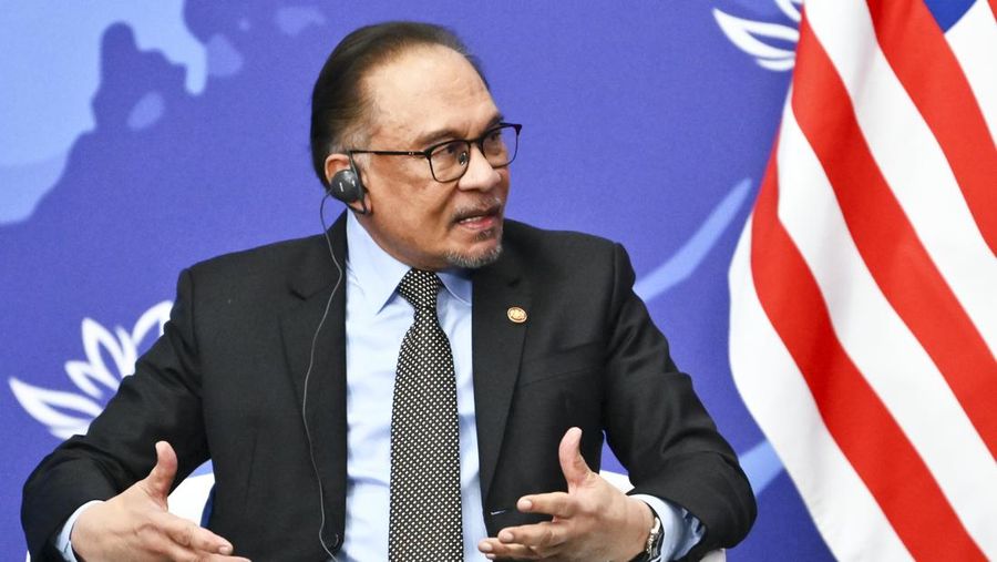 Malaysia's Prime Minister Anwar Ibrahim gestures while speaking to Russian President Vladimir Putin on the sidelines of the Eastern Economic Forum in Vladivostok, Russia, Wednesday, Sept. 4, 2024. (Kristina Kormilitsyna, Sputnik, Kremlin Pool Photo via AP)